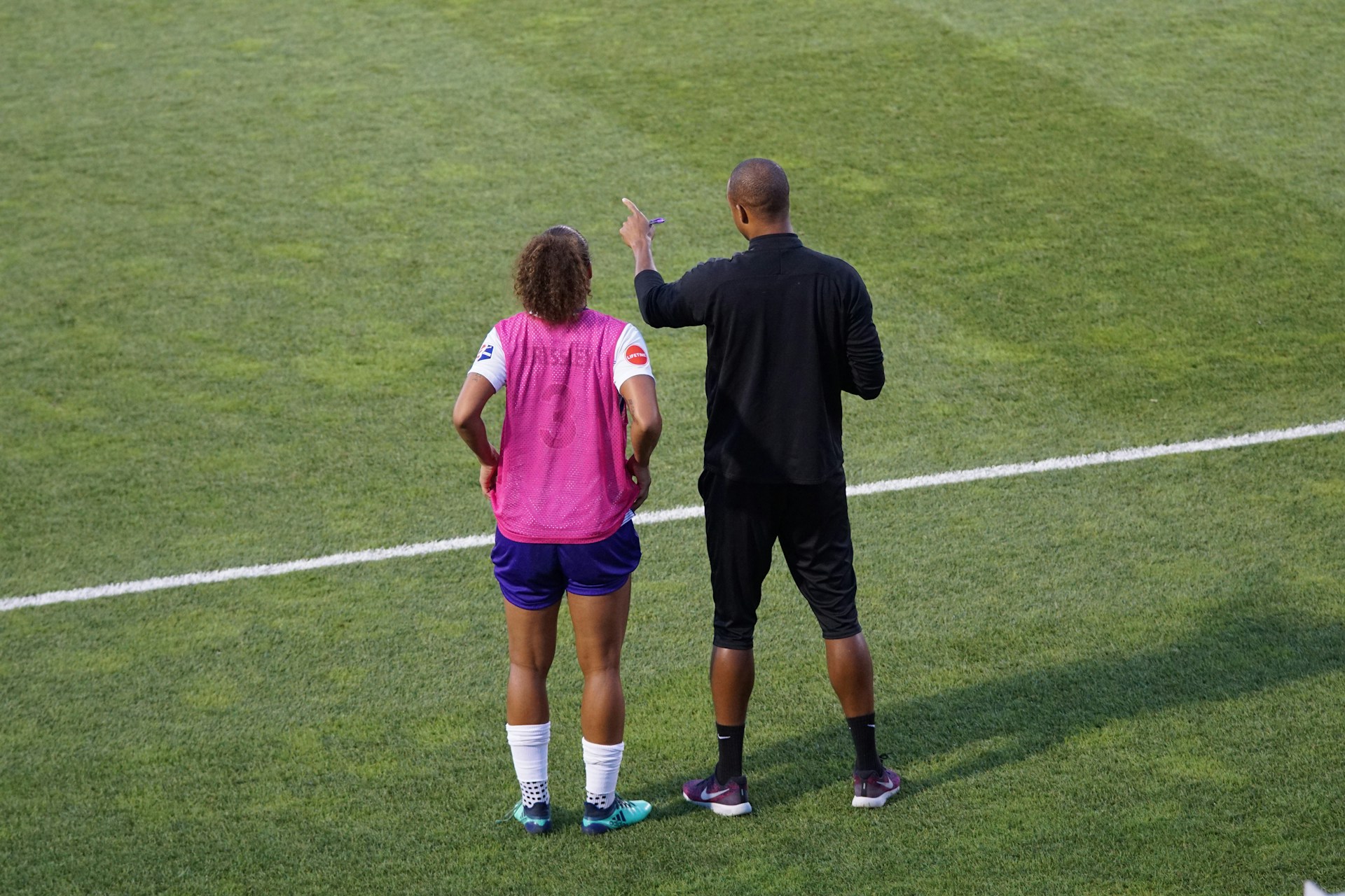 A soccer coach and a soccer player