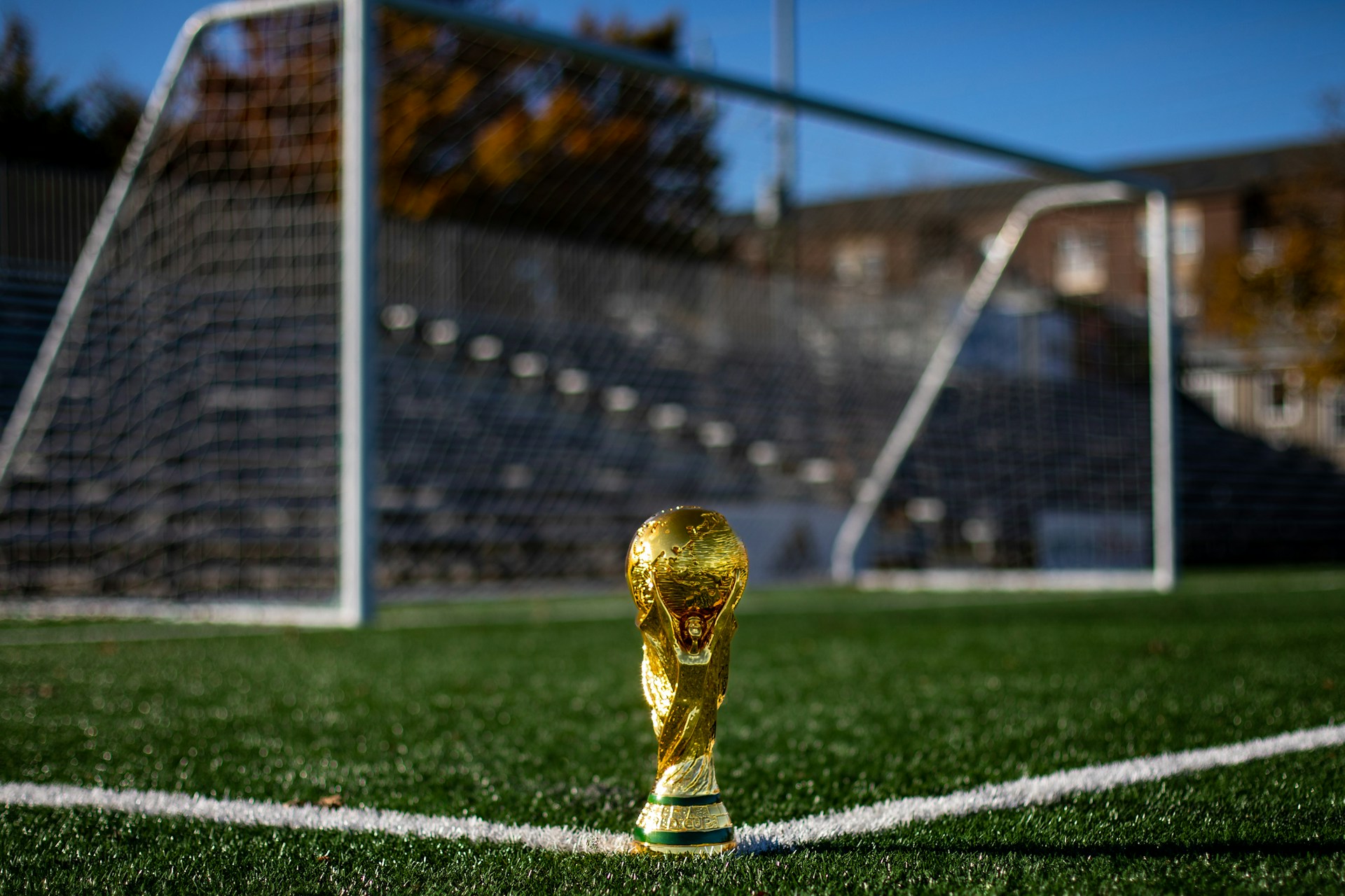 The world cup trophy and a soccer goal